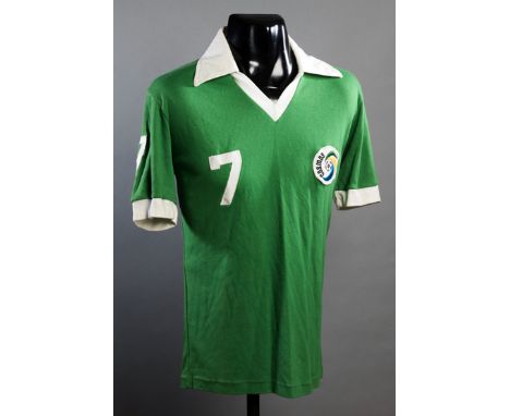 Dennis Tueart Cosmos No.7 jersey from the 1978 Championship season,green & white trimmed jersey numbered 7 to the body, right