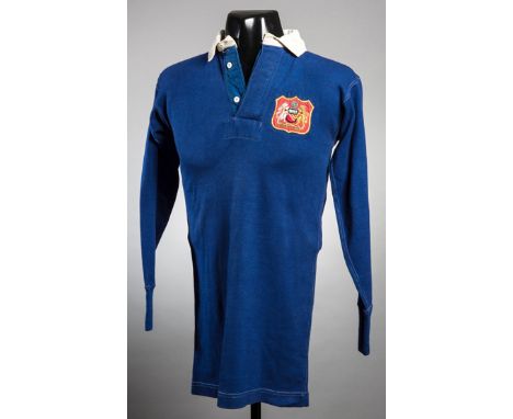 The blue Manchester United No.4 shirt worn by John Anderson in the 1948 F.A. Cup Final,by Umbro, long-sleeved, white button-u