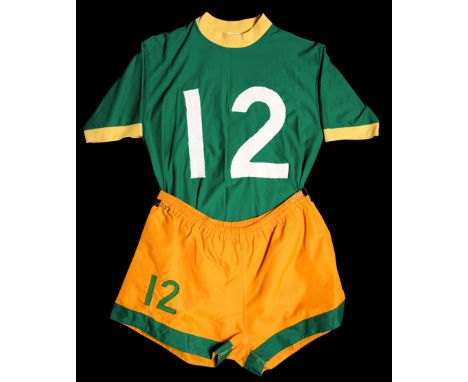 Joey Fink Cosmos No.12 playing kit from the 1973 season,a green short-sleeved jersey with yellow collar and cuffs and with an