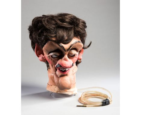 A Spitting Image head puppet of the boxer Barry McGuigan,from the British satirical puppet TV show "Spitting Image", a painte