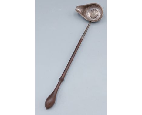 A Georgian Toddy ladle the bowl inset silver coin dated 1758 and with turned wooden handle, 29cms long