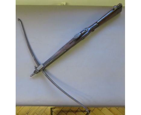 AN ENGLISH STONEBOW, THIRD QUARTER OF THE 18TH CENTURY  with slender steel bow, figured walnut tiller incorporating steel gaf
