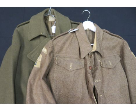 [AP] A WORLD WAR TWO HOME GUARD OFFICER~S BATTLEDRESS the Khaki serge blouse with stand-and-fall collar and button-holes cut 