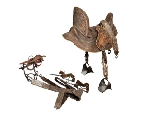 A RARE NORTH AFRICAN DECORATED EQUESTRIAN SADDLE AND HARNESS, ALGERIA OR MOROCCO, 19TH CENTURYthe saddle formed of a wooden t