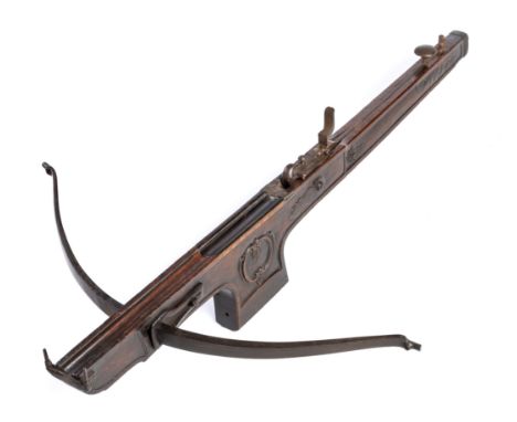 A FLEMISH TARGET CROSSBOW, EARLY 19TH CENTURY  with steel bow retained by a pair of pierced irons (string missing), figured h