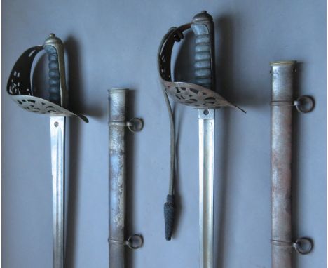 [AP] TWO VICTORIAN 1895 PATTERN INFANTRY OFFICER~S SWORDS BY WILKINSON, NO. 29357 FOR 1889 AND NO. 22523 FOR 1878 each of reg