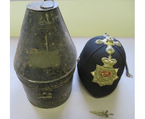 [AP] A BRITISH OFFICER~S CLOTH HELMET, LATE 19TH/EARLY 20TH CENTURY of blue cloth, with white metal fittings, spike and base,