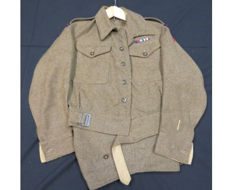 [AP] THREE WORLD WAR TWO PERIOD OFFICERS~ BATTLEDRESS BLOUSES the first a blouse dated 1943, with Captain~s stars, stand-and-