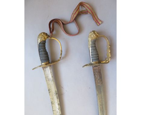 [AP] TWO 1803 PATTERN INFANTRY OFFICER~S SWORDS of regulation type, the first with some etched and gilt decoration on the bla