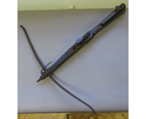 AN ENGLISH STONEBOW, THIRD QUARTER OF THE 18TH CENTURY  with slender steel bow, figured walnut tiller incorporating steel gaf