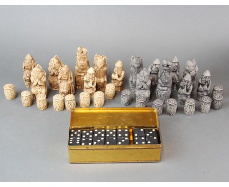 A resin character chess set with a tin of Empire dominoes.