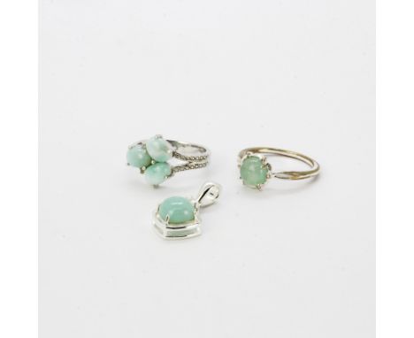 Two 925 silver and silver gilt rings, size O, set with jade, together with a similar 925 silver and jade set pendant.