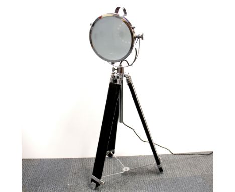 A contemporary search light style lamp on an adjustable tripod base, lowest H. 93cm.