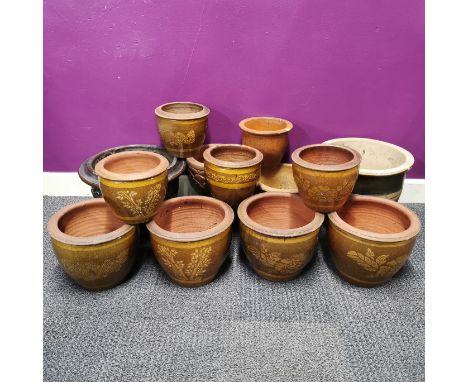 A group of thirteen mixed ceramic plant pots including glazed and stone inset pots, largest H. 26cm Dia. 30cm.