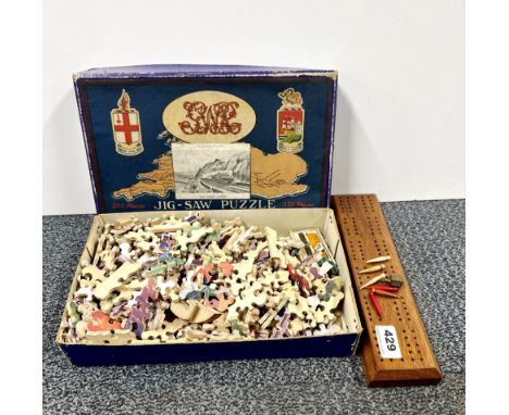 A Great Western Railway wooden jigsaw puzzle, together with a cribbage board and pegs.