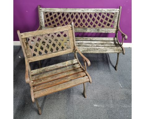 A cast iron garden bench, L. 126cm. H. 76cm. together with a matching cast iron garden seat.