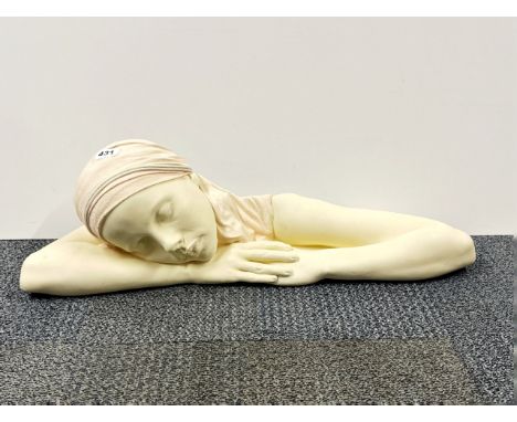 An American "chalk" ceramic figure signed on the reverse, L. 70cm.