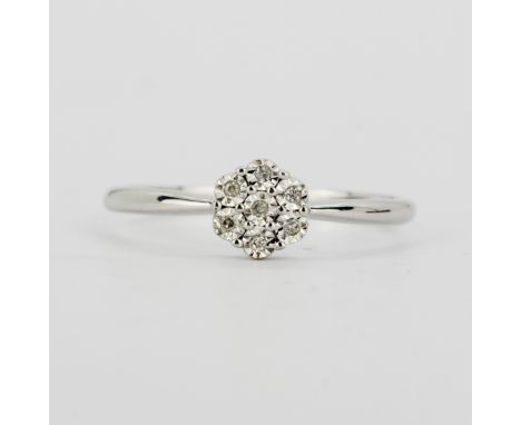 A 9ct white gold (stamped 375) cluster ring set with brilliant cut diamonds, (M.5).