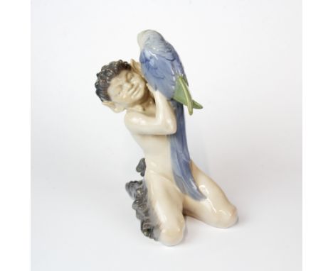 A Royal Copenhagen porcelain figure of a fawn with a parrot, H. 18cm.