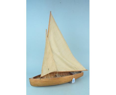 A vintage planked wood constructed two sail model boat, 55cm long