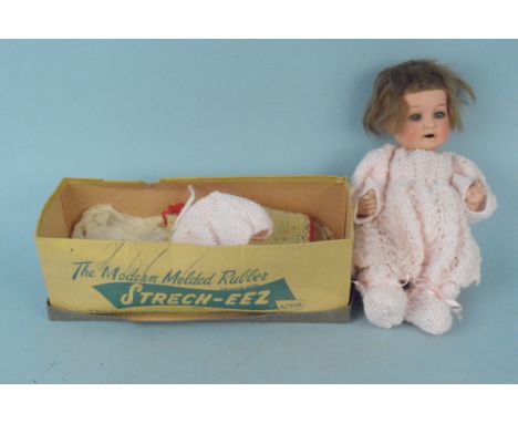 A vintage Heubach Koppelsdorf 321.4/0 composite small doll with closing eyes and open mouth (damage to fingers and hair)