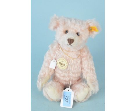 A Steiff mohair 'rose pink' bear with button and labels