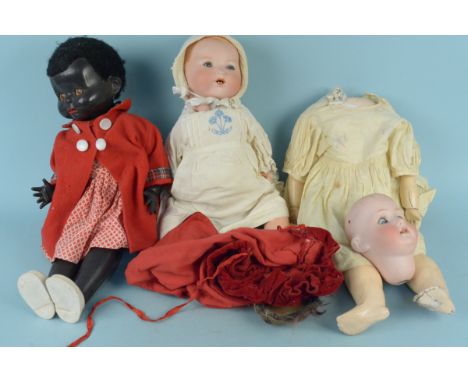 A vintage Armand Marseille bisque head doll No.351/G.K., with jointed limbs, open mouth and sleepy eyes, approx 50cm long plu