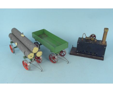A Mamod style steam engine plus a trailer and a log wagon