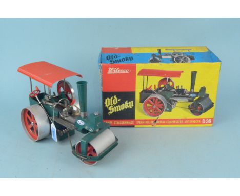 A boxed vintage Wilesco Old Smoky D36 steam roller, approx 31cm long (signs of mild use)
