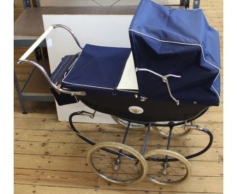 A vintage 1960's Marmet dolls pram with doll (very clean condition)