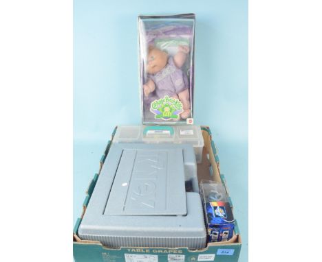 A boxed Cabbage Patch Kids Baby together with two boxes of K'Nex construction sets and a Kung Shu battle hamster 