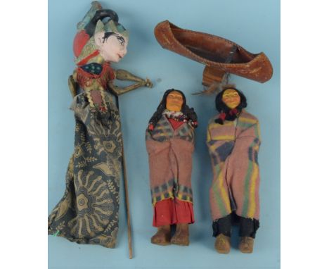 A vintage (possibly Thai) puppet with moveable head and arms (as found) plus two Native American doll figures and a leather c