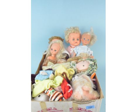 A box of mixed vintage plastic dolls, some maker marked plus a selection of soft toys and clothes