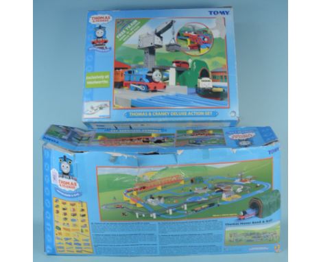 Two boxed Thomas the Tank Engine sets, Motor, Roads and Rails and Thomas and Cranky Deluxe Action Set (contents disturbed and