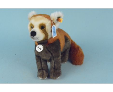 A Steiff collectors red panda, button to ear and labels attached