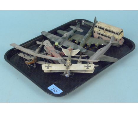 A selection of vintage plastic model planes, a tin plate example plus a vintage Dinky bus (playworn condition)