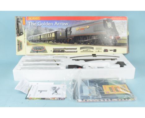 A boxed Hornby 00 gauge 'The Golden Arrow' Boscastle R119, engine and carriages appear unused and in mint condition (box with