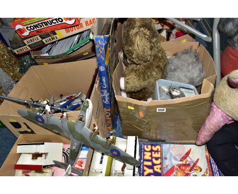 FOUR BOXES AND LOOSE TOYS PICTURES AND CLOCKS ETC, to include a grey Merrythought dog wearing a red cape, hight approximately