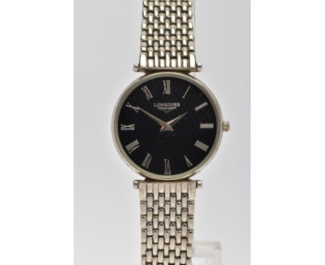A GENTLEMENS 'LONGINES' WRISTWATCH, round black textured dial signed 'Longines', Roman numerals, silver hands, plain polished