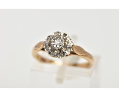 A 9CT GOLD DIAMOND CLUSTER RING, slightly raised cluster within an illusion set single cut diamond to the centre, within a su