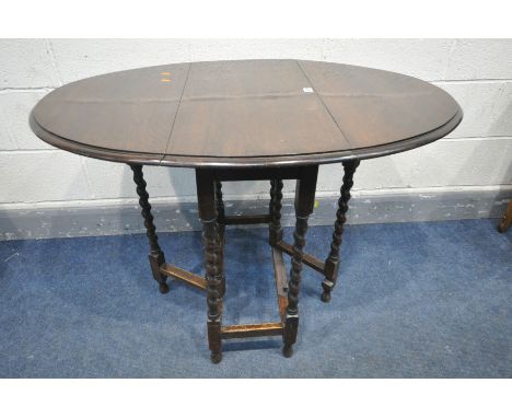 AN OAK BARLEY TWIST GATE LEG TABLE, open length 106cm x closed length 40cm x depth 76cm x height 71cm