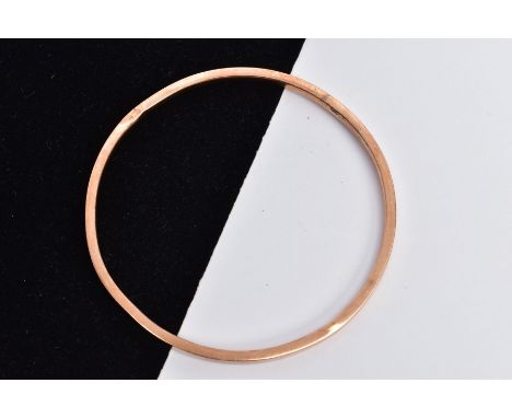 A 9CT ROSE GOLD HOLLOW BANGLE, plain polished design, hallmarked 9ct gold Birmingham, approximate gross weight 7.6 grams (con