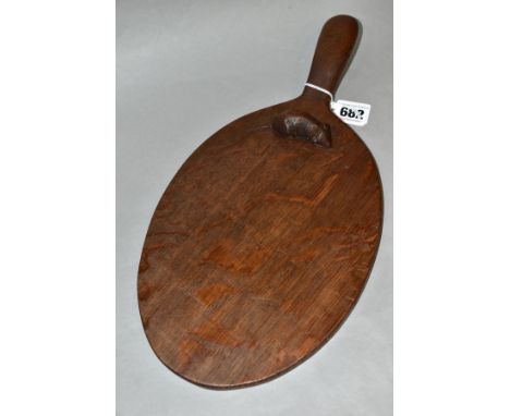 A ROBERT THOMPSON MOUSEMAN OAK CHEESE BOARD, waxed and dark oak oiled finish, oval form, length 36.5cm (Condition report: rec