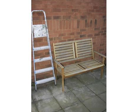 A TEAK GARDEN BENCH, width 120cm x depth 57cm x height 95cm together with a set of step ladders, height 165cm (2)