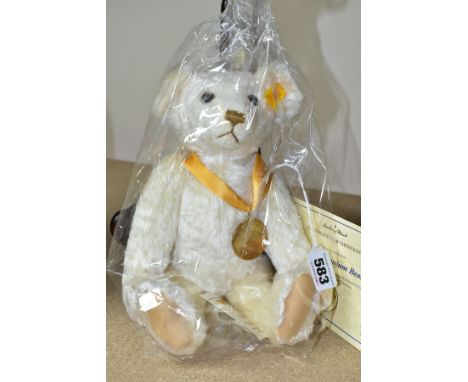 A DANBURY MINT STEIFF THE MILLENNIUM BEAR, handmade, blonde, wearing a Millennium medal, with Steiff button and yellow label 