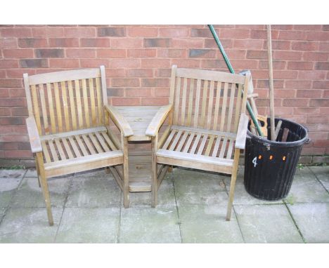 A TEAK CURVED SIDE BY SIDE GARDEN SEATING UNIT with two shelves and a parasol holder to centre together with a small quantity