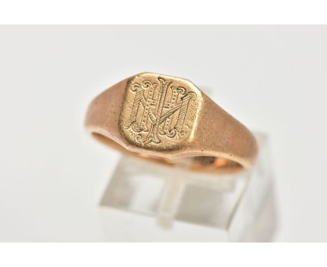 A GENTLEMENS 9CT GOLD SIGNET RING, of a square design with an engraved monogram, to a plain polished tapered band, hallmarked