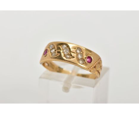 AN EARLY 20TH CENTURY RUBY AND DIAMOND RING, wide band set with two rows of three rose cut diamonds, and one row of three col