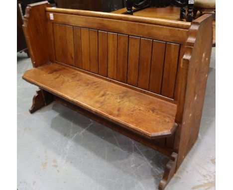A 19th century pitch-pine chapel pew, later shortened, L: 147 cm.