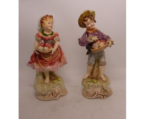 Two Foreign porcelain Capodimonte-style figures depicting a boy and a girl each holding a basket of fruit. (H: 26cm) (2)